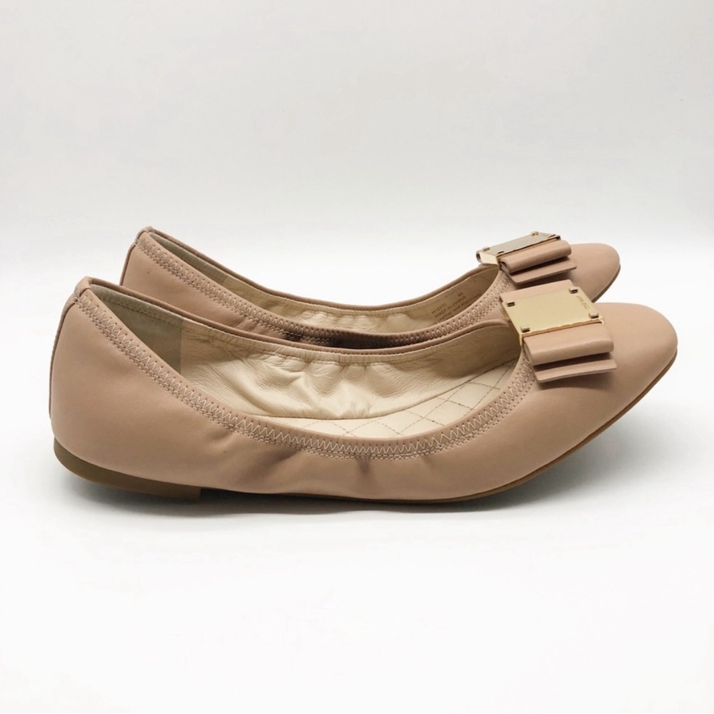 Cole Haan nude leather ballet flats with gold bow accent. Worn twice